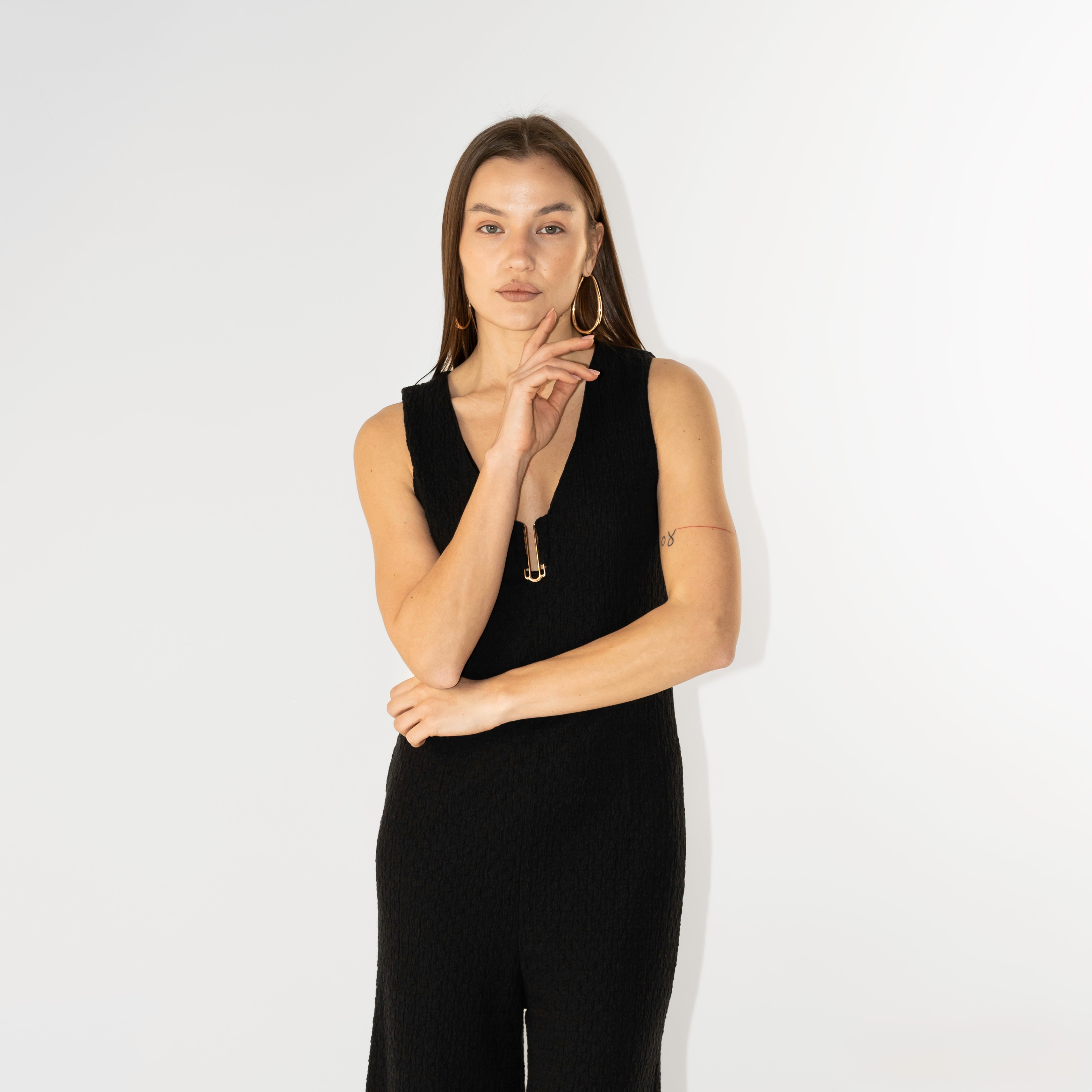 Tuta Jumpsuit smanicata con texture martellata